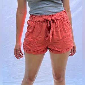 Pink, high-waisted, flowy, beach shorts with tie